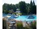Community pool with lounge chairs, umbrellas, and slide for Gathering fun at 214 Gaston Ct, Canton, GA 30115
