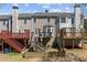 Multiple decks provide outdoor living spaces in the backyard, perfect for entertaining at 3972 Church View Ln, Suwanee, GA 30024