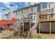 Multi-level decks provide ample outdoor living space overlooking the backyard at 3972 Church View Ln, Suwanee, GA 30024