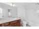 Bathroom with ample vanity counter space, a large mirror, and a shower-tub combo at 3972 Church View Ln, Suwanee, GA 30024