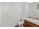 Neutral bathroom with laminate countertops, chrome fixtures, and a white toilet at 3972 Church View Ln, Suwanee, GA 30024