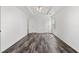 Spacious bedroom features wood-look flooring and trey ceiling and two doors at 3972 Church View Ln, Suwanee, GA 30024