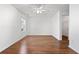 Well-lit bedroom with hardwood floors and a walk-in closet at 3972 Church View Ln, Suwanee, GA 30024