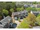 A well-maintained townhome with brick and siding, showcasing the manicured landscaping and inviting curb appeal at 3972 Church View Ln, Suwanee, GA 30024