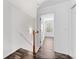Bright hallway with wood floors leading to a bedroom with natural light at 3972 Church View Ln, Suwanee, GA 30024
