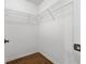 Walk-in closet featuring wood floors and wire shelving at 3972 Church View Ln, Suwanee, GA 30024