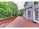 Spacious deck with beautiful railings, ideal for enjoying the outdoors and backing up to mature trees at 2165 Sugarstone Ct, Lawrenceville, GA 30043