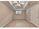 Cozy basement area with neutral paint, a window for natural light, and tile floors at 2165 Sugarstone Ct, Lawrenceville, GA 30043