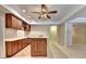 Basement bar area with wood cabinets and a beverage center at 2165 Sugarstone Ct, Lawrenceville, GA 30043
