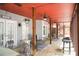 Charming covered patio offering ample seating, ceiling fans, and stone flooring, great for outdoor relaxation at 2165 Sugarstone Ct, Lawrenceville, GA 30043