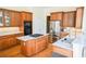 Well-appointed kitchen with stainless steel appliances, granite countertops, and a kitchen island at 2165 Sugarstone Ct, Lawrenceville, GA 30043