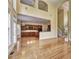 Open concept living area with hardwood floors and natural light offering a combined living and kitchen space at 2165 Sugarstone Ct, Lawrenceville, GA 30043