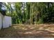 Expansive backyard with mature trees offers plenty of space for outdoor activities and relaxation at 2437 Clarissa Nw Dr, Atlanta, GA 30318