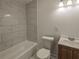 Stylishly updated bathroom features modern tile, a fresh vanity, and bright lighting at 2437 Clarissa Nw Dr, Atlanta, GA 30318