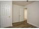 Clean, well-lit bedroom boasts modern flooring and fresh paint, creating a comfortable and inviting space at 2437 Clarissa Nw Dr, Atlanta, GA 30318