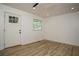 Bright, airy living room features modern flooring, fresh paint, and ample natural light at 2437 Clarissa Nw Dr, Atlanta, GA 30318