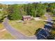 Charming brick home with a spacious front yard, surrounded by lush greenery and neighborhood streets at 244 Saint Patrick Sw Dr, Mableton, GA 30126