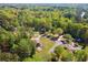 A beautiful brick house nestled in a lush green neighborhood with mature trees creating a private atmosphere at 244 Saint Patrick Sw Dr, Mableton, GA 30126