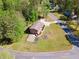 A brick house boasts an expansive lawn, complemented by mature trees and a tranquil residential setting at 244 Saint Patrick Sw Dr, Mableton, GA 30126