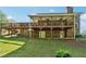 Large backyard featuring a deck, patio, and mature landscaping at 244 Saint Patrick Sw Dr, Mableton, GA 30126