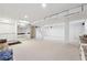 Finished basement with neutral carpet, support beams, and built-in features at 244 Saint Patrick Sw Dr, Mableton, GA 30126