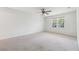 Spacious bedroom features neutral carpet, ceiling fan and natural light at 244 Saint Patrick Sw Dr, Mableton, GA 30126