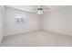 Bright bedroom features neutral carpet, ceiling fan and natural light at 244 Saint Patrick Sw Dr, Mableton, GA 30126