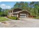 Brick home featuring an attached garage and concrete driveway at 244 Saint Patrick Sw Dr, Mableton, GA 30126