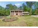 Beautiful brick home with a large front yard and mature trees at 244 Saint Patrick Sw Dr, Mableton, GA 30126