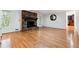 Bright room featuring hardwood floors and a brick fireplace at 244 Saint Patrick Sw Dr, Mableton, GA 30126
