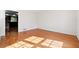 Open room featuring hardwood floors and a view of the kitchen at 244 Saint Patrick Sw Dr, Mableton, GA 30126