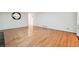 Bright living room featuring hardwood floors and a decorative mirror at 244 Saint Patrick Sw Dr, Mableton, GA 30126