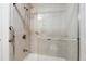 Walk-in shower with grab bars and tiled surround at 244 Saint Patrick Sw Dr, Mableton, GA 30126