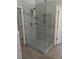 Modern bathroom showcasing a frameless glass shower with marble-style tiling and elegant fixtures at 3657 Clearbrooke Ct, Duluth, GA 30097