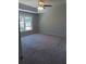 Bedroom with neutral carpeting, gray painted walls, and a bright window at 3657 Clearbrooke Ct, Duluth, GA 30097