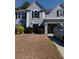 Charming two-story home with an attached two-car garage and manicured landscaping at 3657 Clearbrooke Ct, Duluth, GA 30097