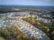 Wide aerial perspective showcasing an attractive residential community near wooded areas and winding streets at 419 Murphy Ave, Canton, GA 30114