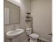 Powder room with pedestal sink and neutral decor at 419 Murphy Ave, Canton, GA 30114