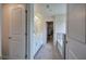 Luxurious bathroom featuring double sinks, a soaking tub, and an entrance to a walk-in closet at 419 Murphy Ave, Canton, GA 30114