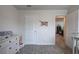Bedroom featuring a gray dresser, closet, and decorated with themed decorations at 419 Murphy Ave, Canton, GA 30114