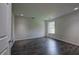 Bedroom features gray hardwood floors, recessed lighting, and a closed white door at 419 Murphy Ave, Canton, GA 30114