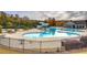 The community pool offers clear blue water, lounge areas, and a slide for a resort-like experience at 419 Murphy Ave, Canton, GA 30114