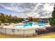 Featuring a spacious deck, water slide, and separate lounging area, the community pool offers Gathering fun at 419 Murphy Ave, Canton, GA 30114