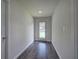 Hallway features gray hardwood floors, recessed lighting, and a door to the backyard at 419 Murphy Ave, Canton, GA 30114