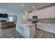 Open-concept kitchen island with sink and sightlines to the living room at 419 Murphy Ave, Canton, GA 30114