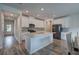 A bright, open kitchen featuring white cabinetry, a central island, and modern appliances at 419 Murphy Ave, Canton, GA 30114