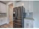 Modern kitchen featuring stainless steel refrigerator and white cabinets at 419 Murphy Ave, Canton, GA 30114
