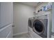 Laundry room with stainless steel front loading washing machine and dryer at 419 Murphy Ave, Canton, GA 30114
