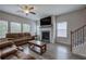 Living room featuring fireplace, hardwood floors, and large windows at 419 Murphy Ave, Canton, GA 30114