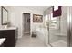 Bright bathroom featuring a soaking tub, walk-in shower, and vanity with granite counters and decorative mirror at 4585 Woodland Bank Blvd, Buford, GA 30518